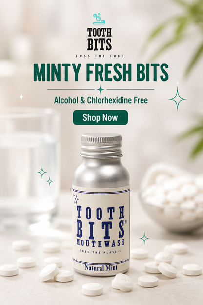 A bottle of Tooth Bits Mouthwash labeled Natural Mint, surrounded by white mouthwash tablets on a light surface, with a glass and bowl of tablets blurred in the background. Prominent text reads 'TOOTH BITS', 'MINTY FRESH BITS', 'Alcohol & Chlorhexidine Free', and 'Shop Now'.